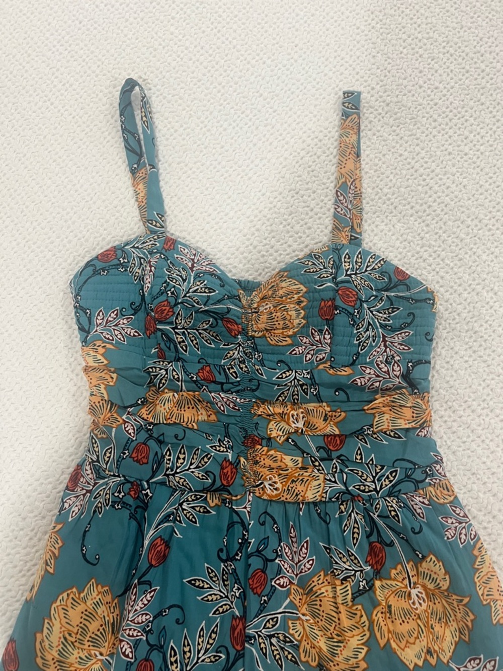 Teal Floral Jumpsuit with yellow and red accents